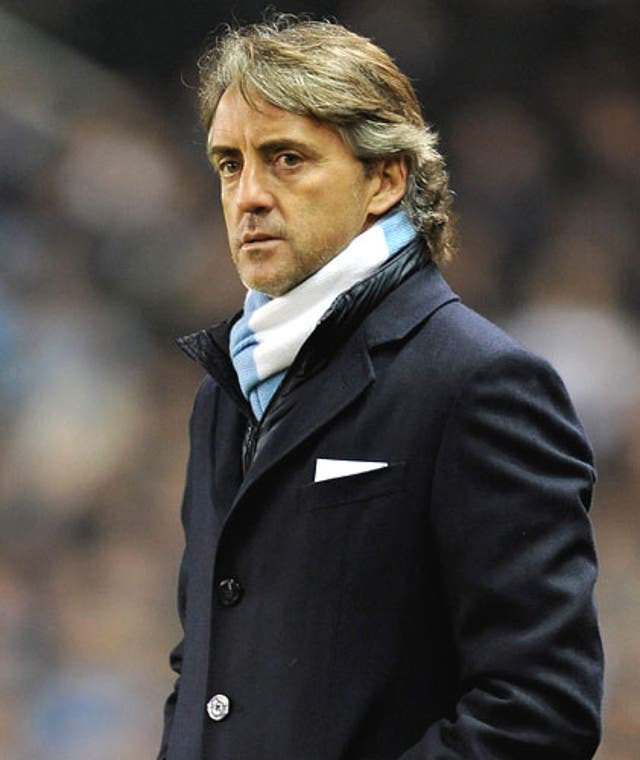 Manchester City manager Roberto Mancini is claiming 'a lot of improvement' since he arrived at Eastlands