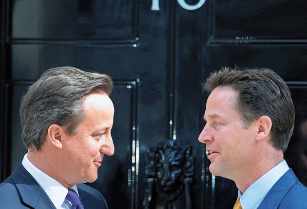 Britain's new Prime Minister David Cameron speaks with his new Deputy Prime Minister Nick Clegg, as they pose for pictures outside 10 Downing Street last week