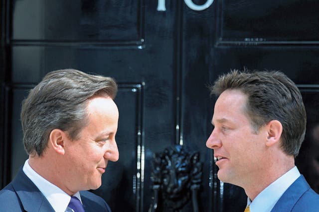 Britain's new Prime Minister David Cameron speaks with his new Deputy Prime Minister Nick Clegg, as they pose for pictures outside 10 Downing Street last week