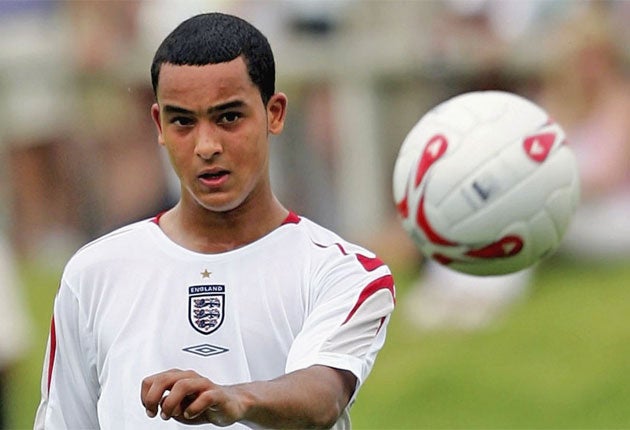 Walcott (above) described David Beckham as 'one of the perfect professionals'