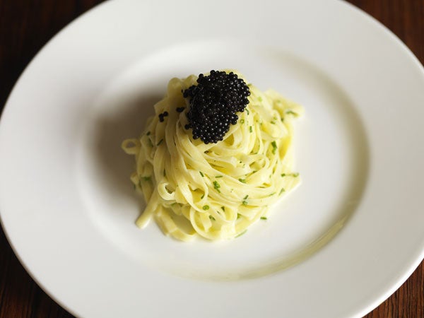 Spoon the pasta on to serving plates and spoon the caviar on top