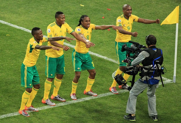 South African players celebrate Siphiwe Tshabalala's (No 8) wonder goal in the opening match of the tournament