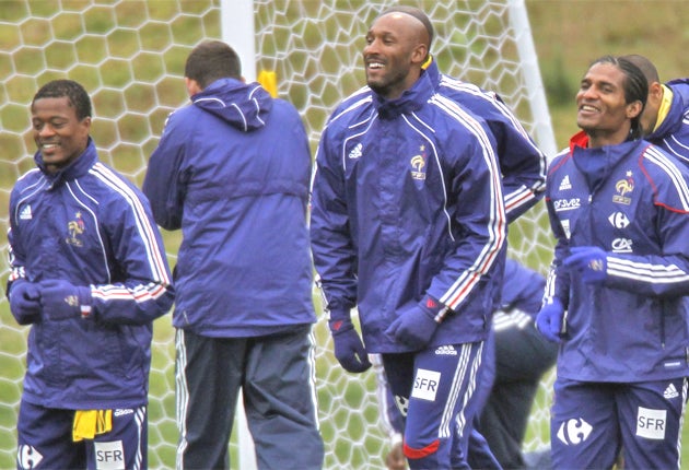 Anelka (centre) trains with his French team-mates during their disasterous World Cup in South Africa