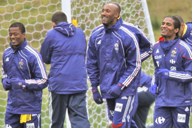 Anelka (centre) trains with his French team-mates during their disasterous  World Cup in South Africa