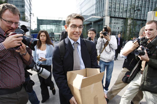 A man carries a box from Lehman Brothers' offices in London after the bank failed in 2008