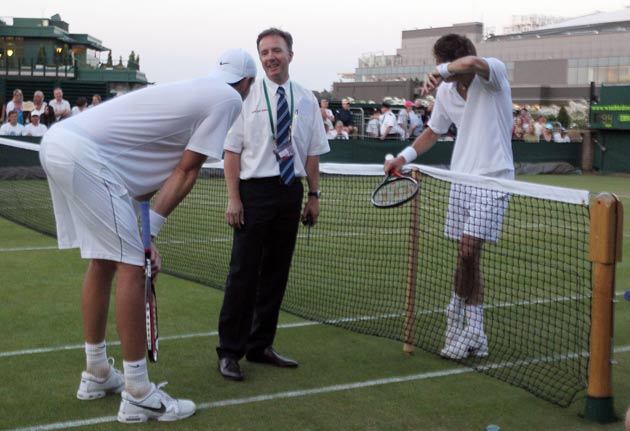 Isner (left) and Mahut (right) during their epic contest at Wimbledon this week