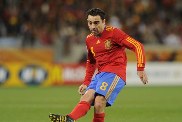 Xavi says Spain are improving