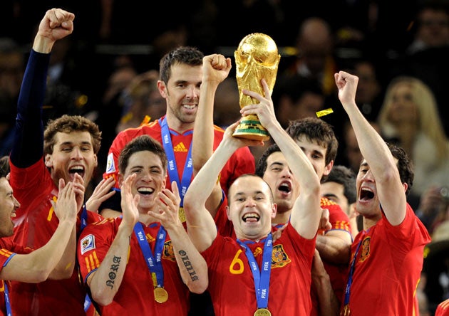 Andres Iniesta (with trophy) and his Spanish team-mates celebrate winning the World Cup in South Africa