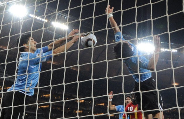 Luis Suarez saves a shot with his hands which would have sent Ghana to the World Cup semi-finals