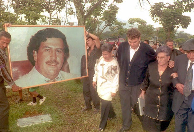 Hermilda de Escobar, mother of Medellin drug cartel kingpin Pablo Escobar, walks with friends and relatives to Escobar’s tomb for the first anniversary of his death