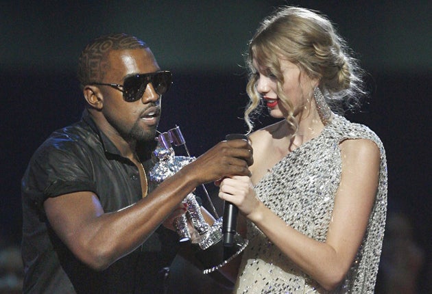 Kanye West invading the stage as Taylor Swift accepts her VMA in 2009
