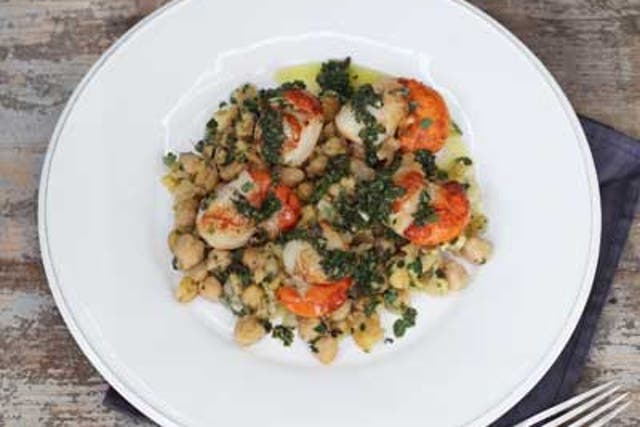 Spoon the chickpeas on to a plate, lay the scallops on top and pour over the green sauce