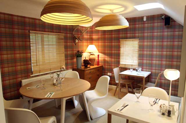 Woodlands Eat has just seven tables and quirky touches such as clusters of antlers, a postmodern grandfather clock and a feature wall of tartan