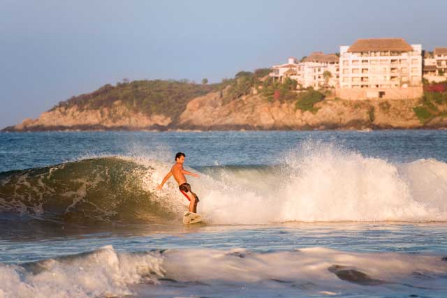 The glorious surfing waves still pound the beaches at Playa Principal and Playa Zicatela