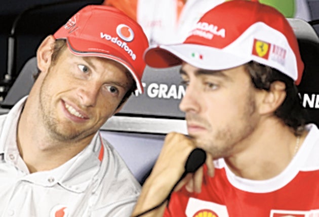 Jenson Button (left) with Ferrari's Fernando Alonso