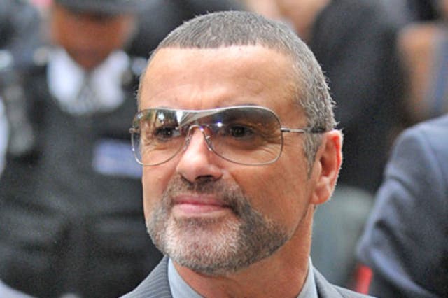 George Michael was found slumped at the wheel of his car after it smashed into a branch of Snappy Snaps in north London in July