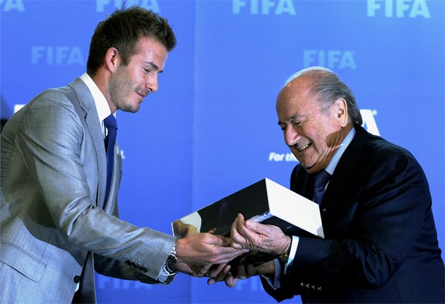 Sepp Blatter pictured receiving England's World Cup 2018 bid document from David Beckham