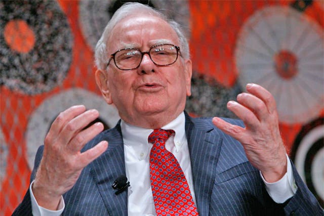 Warren Buffett spent most of 2013 amassing fortunes of over £23million a day through investments into food manufacturing giants like Heinz, which he bought earlier this year