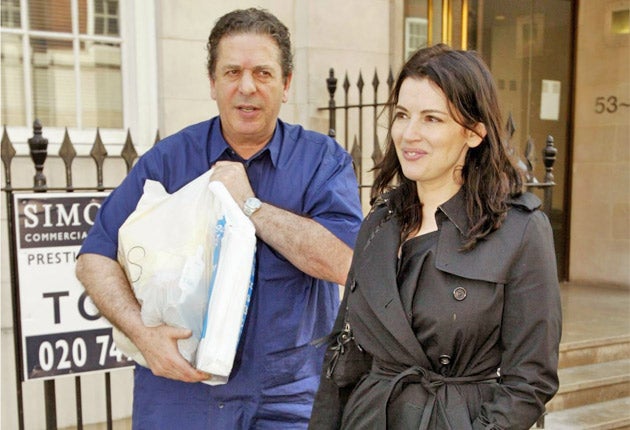 Nigella Lawson and her husband Charles Saatchi pictured in 2010