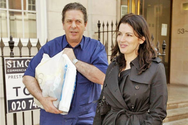 Nigella Lawson and her husband Charles Saatchi pictured in 2010