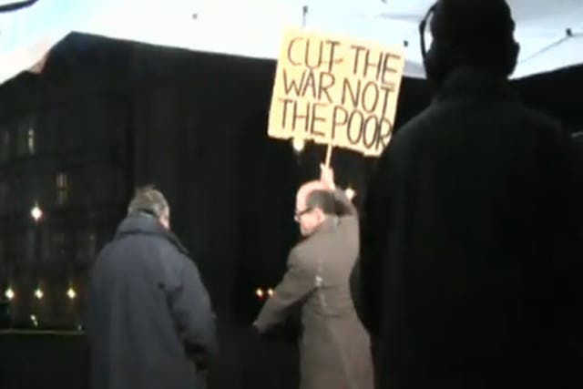 Nick Robinson was caught on camera grabbing and smashing a protester's placard after filming a report