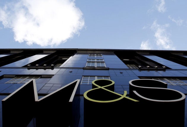 The Marks & Spencer company logo outside the company's flagship store on Oxford Street in London