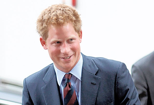Embarrassing pictures showing Prince Harry and a young woman naked in a hotel room have been published on the internet