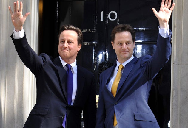 David Cameron and Nick Clegg arrive at Downing Street in May
