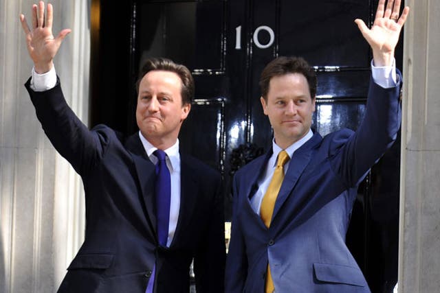 David Cameron and Nick Clegg arrive at Downing Street in May