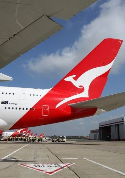 More than two dozen passengers became ill with a stomach bug during a 14-hour Qantas flight