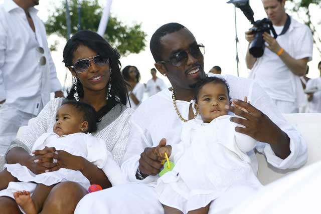 Diddy with Kim Porter and their twin daughters in 2007
