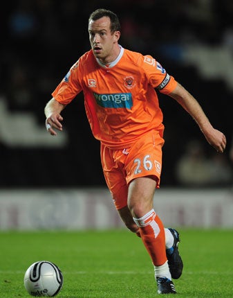 Blackpool's Charlie Adam will be rewarded with a transfer to a top club despite his failure to secure a move on deadline day, according to the Scotland manager