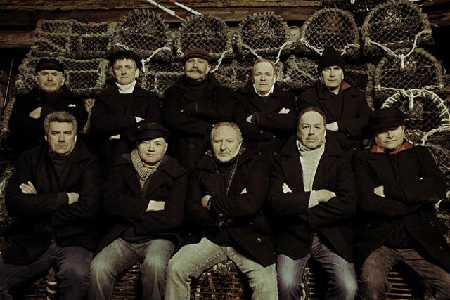 The Fisherman's Friends grew up in the same village and have been singing together for 16 years - Trevor Grills pictured back row, second from right.