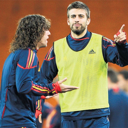 Carles Puyol returns but Gerard Pique (right) is suspended