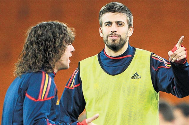 Carles Puyol returns but Gerard Pique (right) is suspended