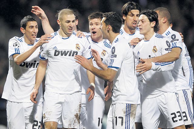 Real Madrid's former Lyons striker Karim Benzema (second left) scored against his old club on Tuesday night