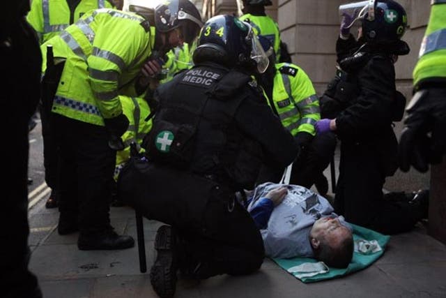 Police asked a pathologist to determine whether Ian Tomlinson was assaulted or injured in a crush during the G20 protests
