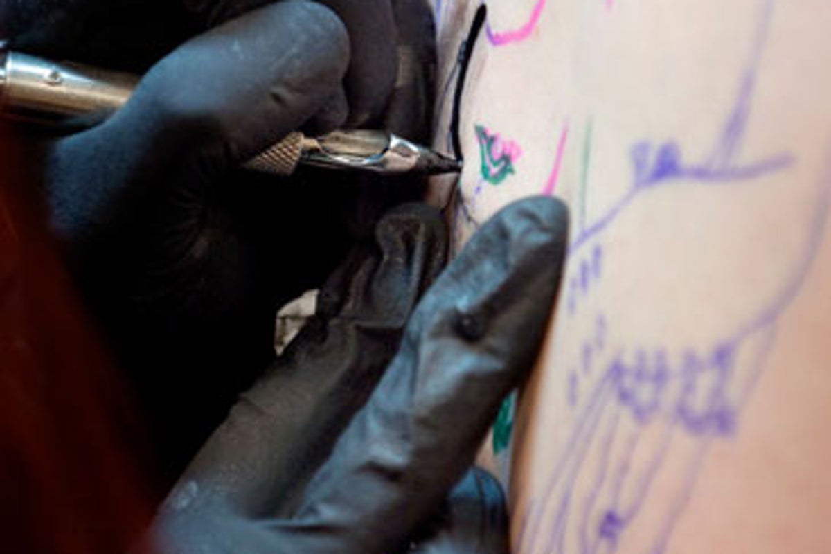 Mother arrested as 10-year-old found to have large tattoo | The Independent