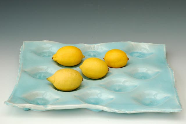 {1} FRUIT TRAY<br/>Make the fruit the centre ofattention with a dimpled traymade to order by ceramic artist Joanna Howells. Choose from a restrained speckled parchment finish or go crazy with a tray iniridescent sky blue.<br/>£85, notonthehighstreet.