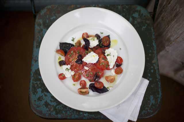 Fresh start: Tomato and goat's curd salad is best served with peasant-style bread