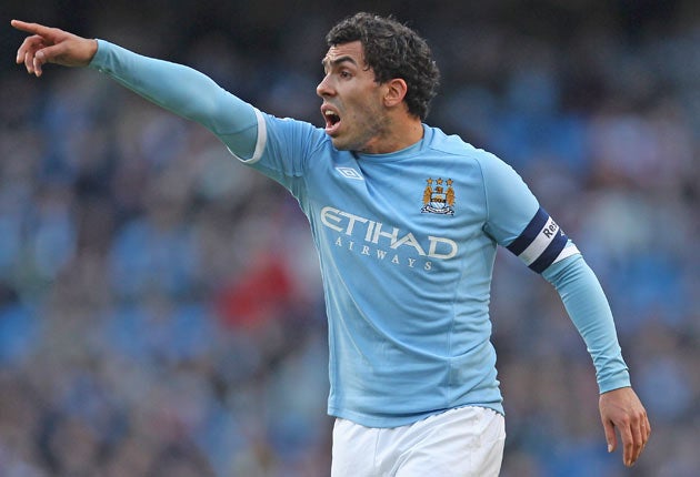 Mancini says Tevez has told him he wants to stay