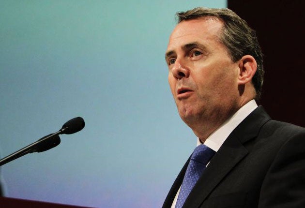 Liam Fox was attending talks with fellow Nato defence ministers to review the allied effort
