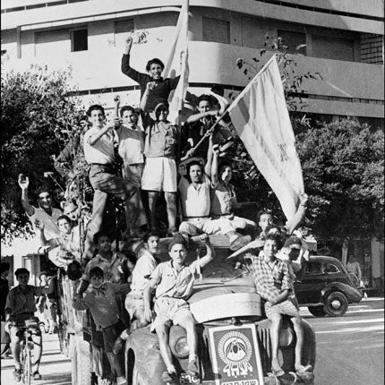 Jews in Tel Aviv mark the creation of the new state in May 1948