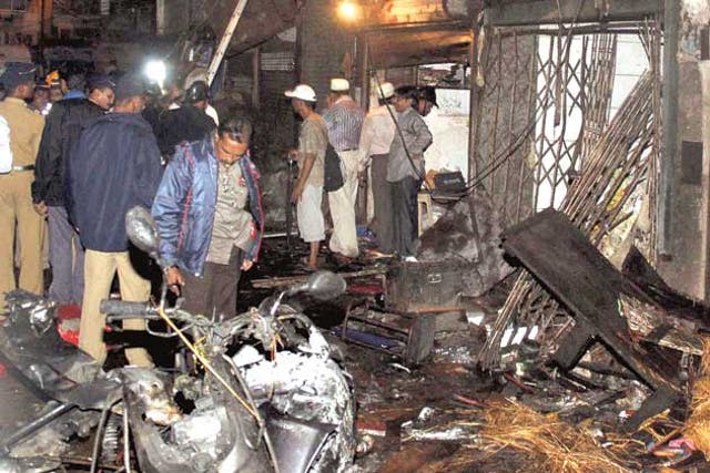 Nepal's official media say police have arrested a man suspected of links to the triple bomb blasts in Mumbai