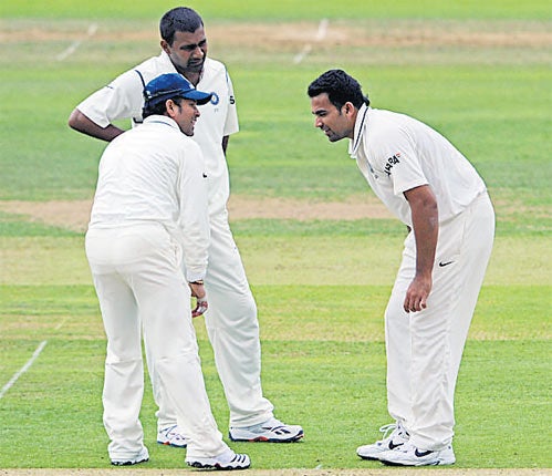 India's No 1 paceman, Zaheer Khan (right), pulls up lame with a hamstring injury at Lord's