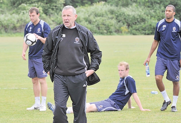 Terry Brown oversees his AFC Wimbledon players in training ahead of their opener against Bristol Rovers