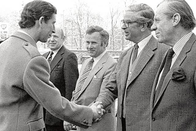 Macvicar, as the Chairman of Governors of Dean Orphanage and Cauvin's Trust, greeting a young Prince Charles
