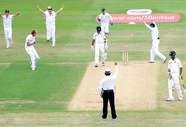 England’s players celebrate the crucial wicket of Rahul Dravid before lunch at Trent Bridge yesterday