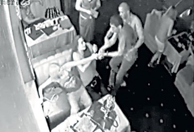 A man believed to be Roman Landik is seen on video allegedly beating Maria Korshunova in Luhansk's Bakkara restaurant on 4 July