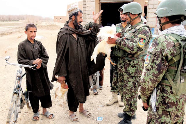 Afghan troops in Nad-e Ali; locals say they fear Taliban less now and trust the police more